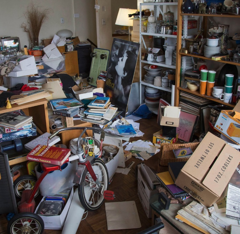 Resident in a cluttered home before Madison Heights cleanout help